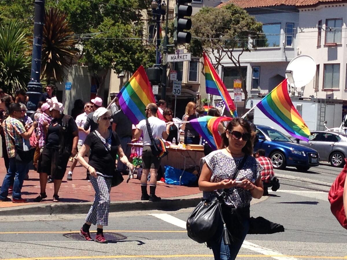 Gay-rights supporters celebrate the Supreme Court's decision on Proposition 8 on Wednesday at Castro and Market streets in San Francisco.
