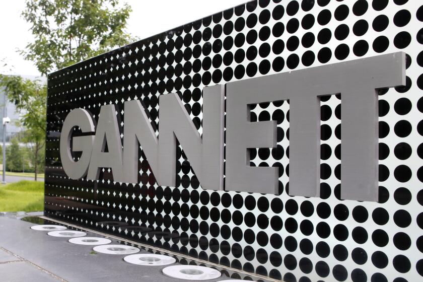 FILE - In this July 14, 2010, file photo, the Gannett Co.headquarters sign stands in McLean, Va. The Wall Street Journal is reporting that MNG Enterprises, better known as Digital First Media, is preparing to bid for newspaper publisher Gannett Co. (AP Photo/Jacquelyn Martin, File)