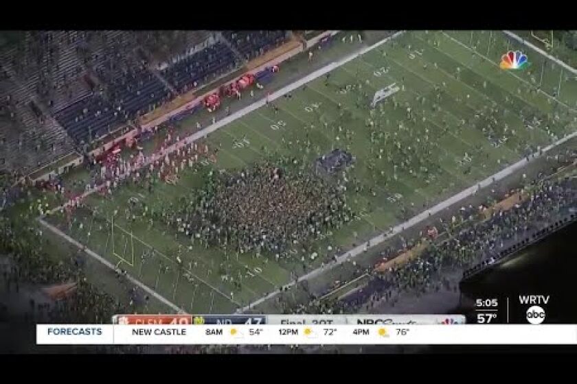 Notre Dame fans and students rush field