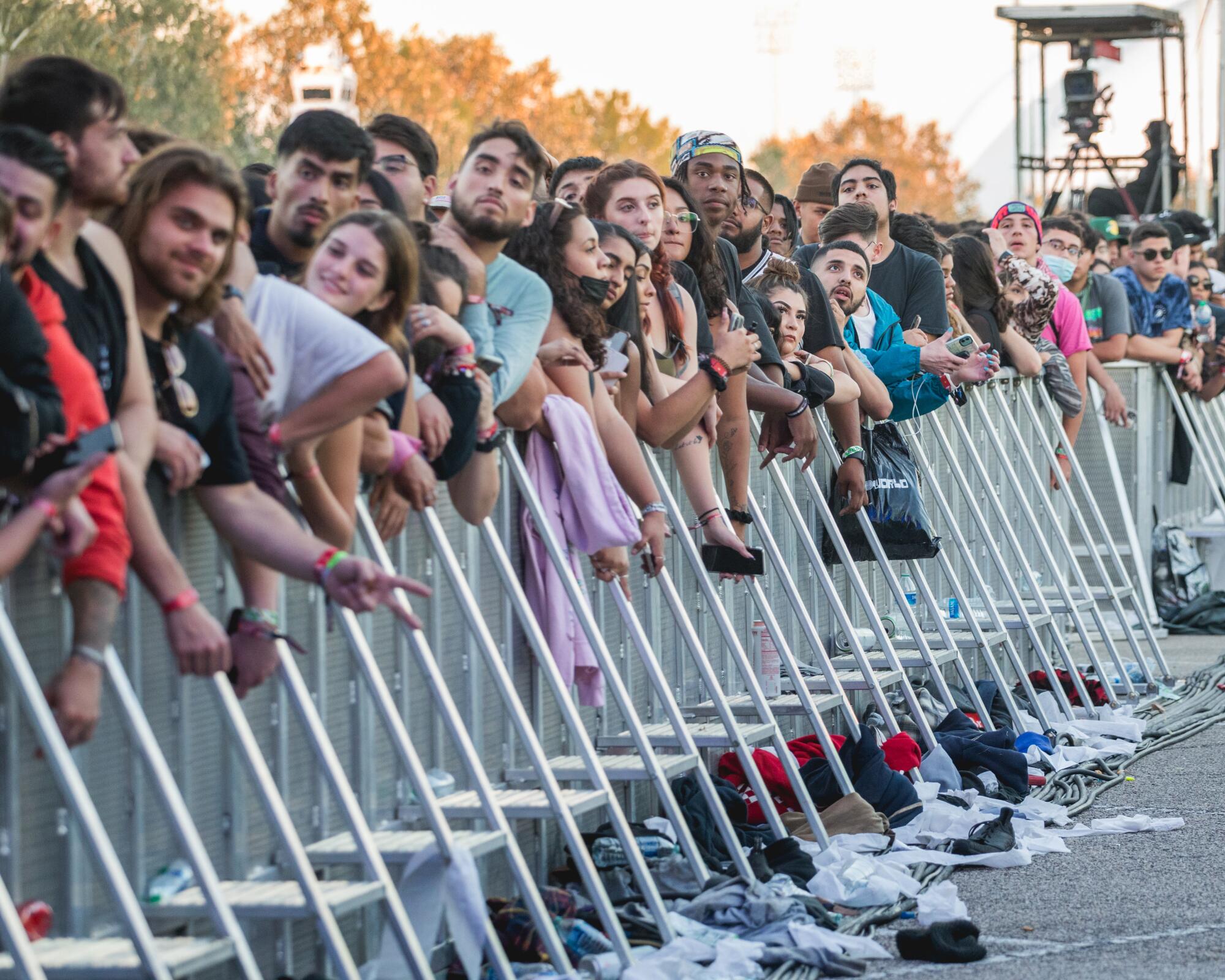 Music fans lean on barricades at the Astroworld Festival in Houston in November.