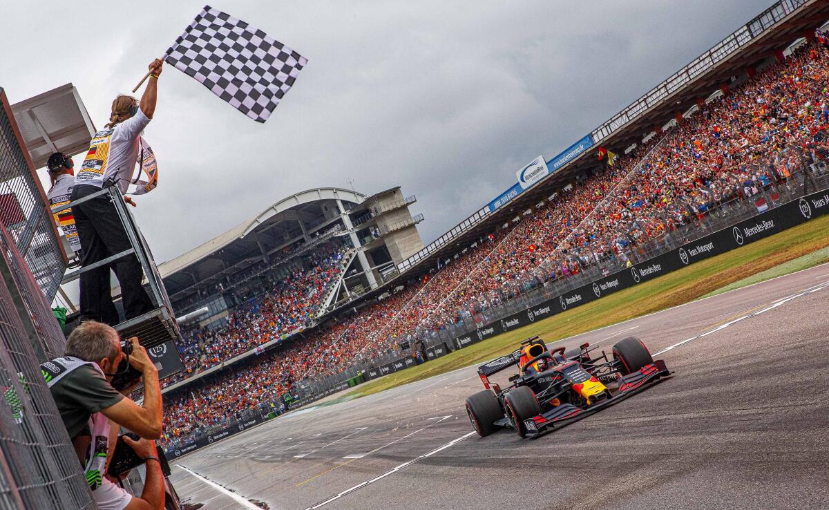 Max Verstappen crosses the finish line to win the German Grand Prix on Sunday.
