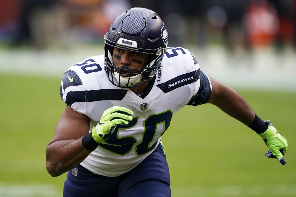 FILE - In this Dec. 20, 2020, file photo, Seattle Seahawks outside linebacker K.J. Wright rushes during the team's NFL football game against the Washington Football Team in Landover, Md. The Las Vegas Raiders have added another proven veteran to bolster their banged-up linebacker group, agreeing to a one-year contract with Wright. A person familiar with the deal says that the two sides reached the deal on Thursday, Sept. 2. The person spoke on condition of anonymity because the contract can't be signed until after Wright passes a physical. (AP Photo/Mark Tenally, File)