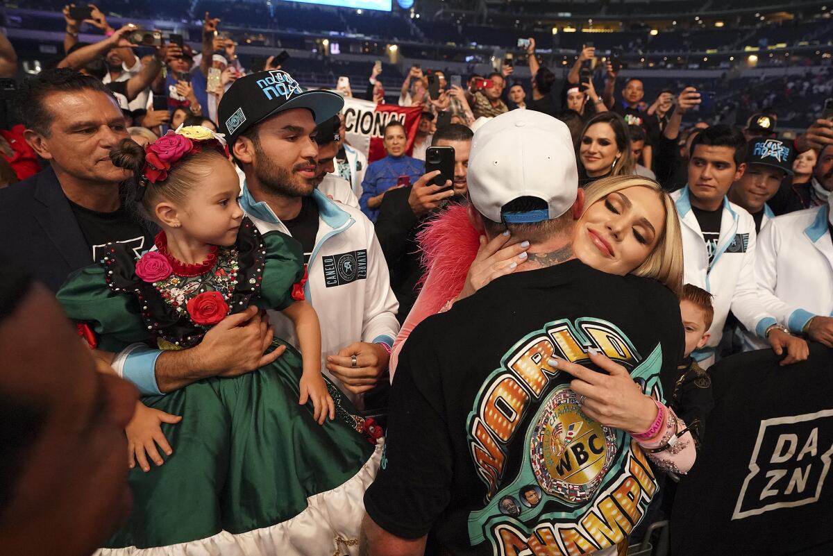 Canelo Alvarez hugs his girlfriend 