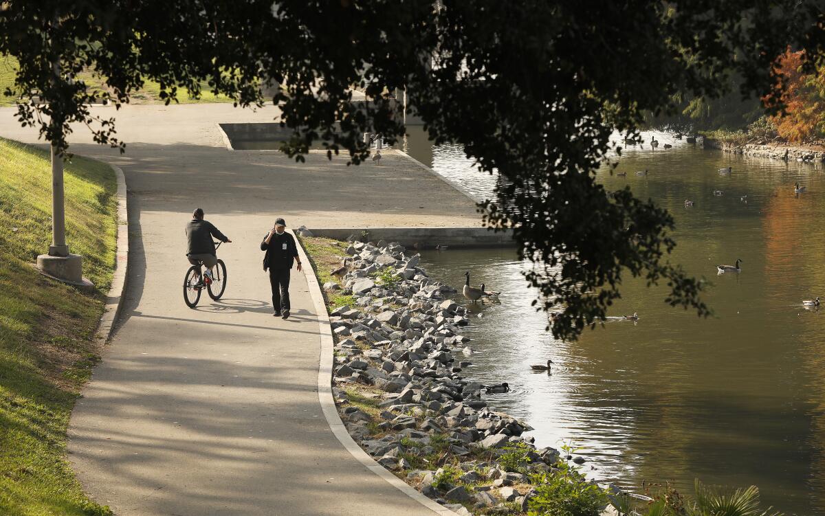 People enjoy Hollenbeck Park in Boyle Heights. 