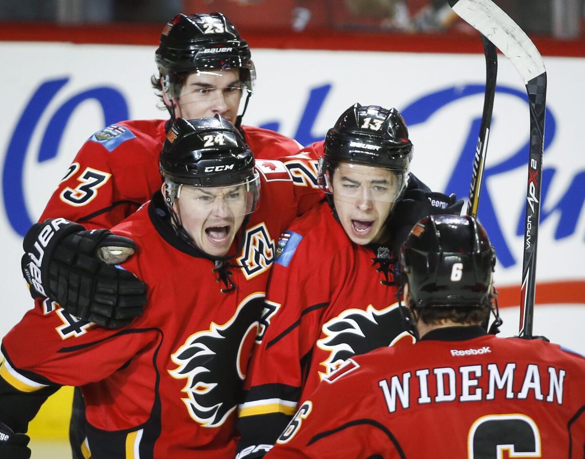 Calgary's Johnny Gaudreau, center-right, celebrates a goal against the Canucks during Game 4 of the Flames' first round playoff series with Vancouver.