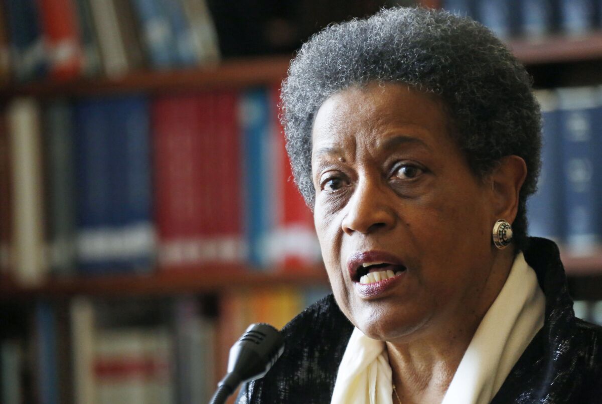 A head-and-shoulders image of Myrlie Evers-Williams speaking to a microphone.
