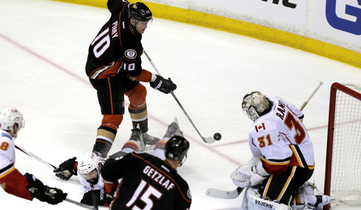 Ducks right wing Corey Perry (10), who had two goals and two assists in Game 1, takes a shot against Flames goalie Karri Ramo in the third period Thursday night.