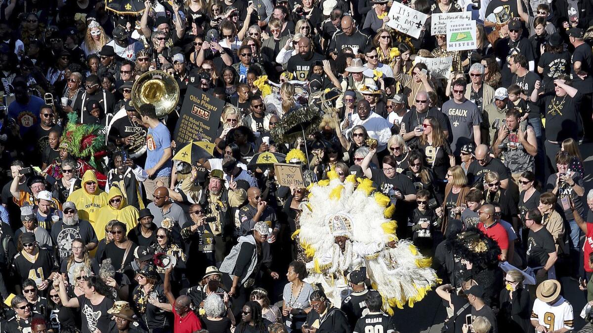 Who Dats fill North Peters Street during a parade Feb. 3 in New Orleans to protest the no-call that likely cost the Saints a spot in the Super Bowl.