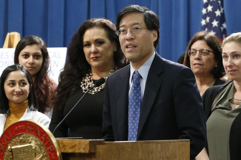 State Sen. Richard Pan, D-Sacramento, center, discusses his proposed measure to have public health officials grant medical exemptions for vaccination instead of leaving the power to physicians, during a news conference, Tuesday, March 26, 2019, in Sacramento, Calif. Opponents say the move is unnecessary because current law has already increased the vaccination rate. (AP Photo/Rich Pedroncelli)