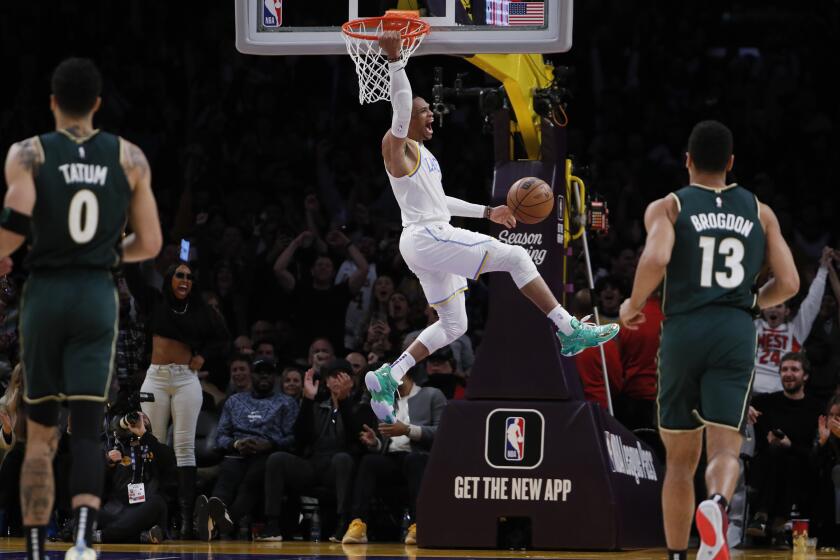 Los Angeles, CA, Tuesday, December 13, 2022 - Los Angeles Lakers guard Russell Westbrook (0) slam dunks during a rally late in the game against the Boston Celtics at Crypto.Com Arena. (Robert Gauthier/Los Angeles Times)