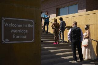 Couples wait in line for marriage licenses in Las Vegas on Friday.