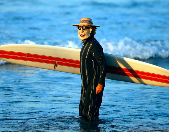 Gary Marshall of Costa Mesa sports a "crazy professor" costume, which won him the scariest costume award in the Blackie's Classics Longboard Assn. Halloween Surf Costume contest at the Newport Pier.
