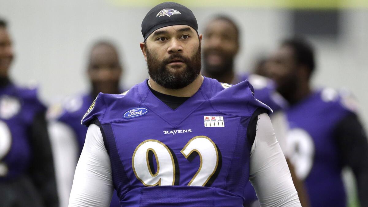 Baltimore Ravens defensive end Haloti Ngata walks off the field after a practice session in Owings Mills, Md., on Dec. 30, 2014. Ngata reportedly was traded to the Detroit Lions on Tuesday.