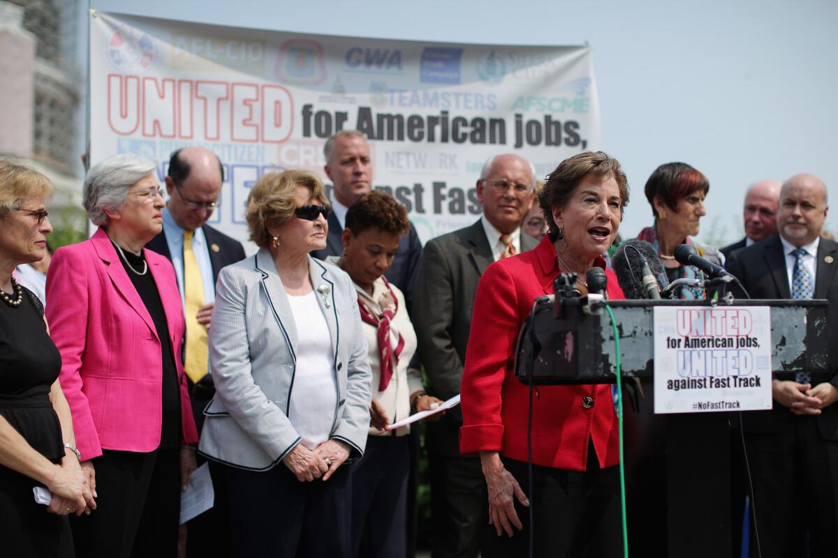 Rep. Jan Schakowsky (D-Ill.) and fellow Democratic members of Congress voice their opposition to the Trans-Pacific Partnership trade deal at the U.S. Capitol.