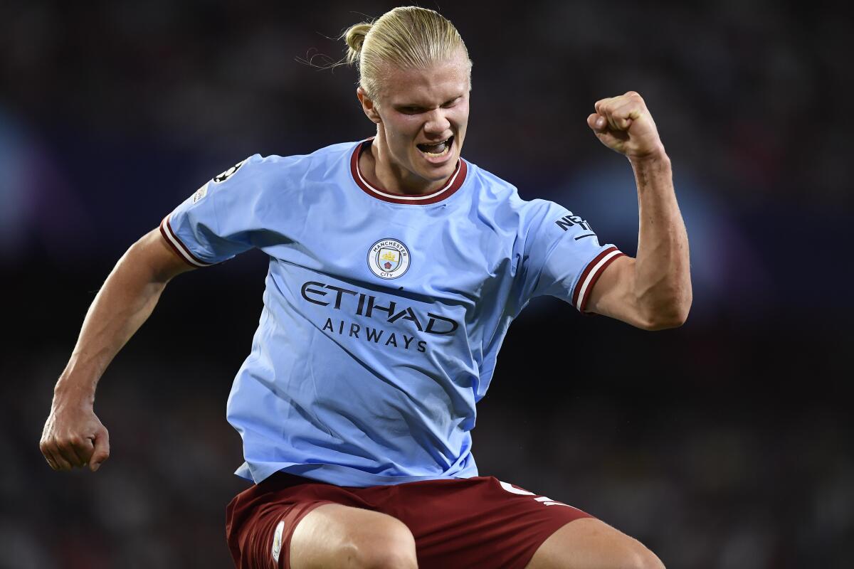 Manchester City's Erling Haaland celebrates after scoring his side's third goal during the group G Champions League soccer match between Sevilla and Manchester City in Seville, Spain, Tuesday, Sept. 6, 2022. (AP Photo/Jose Breton)
