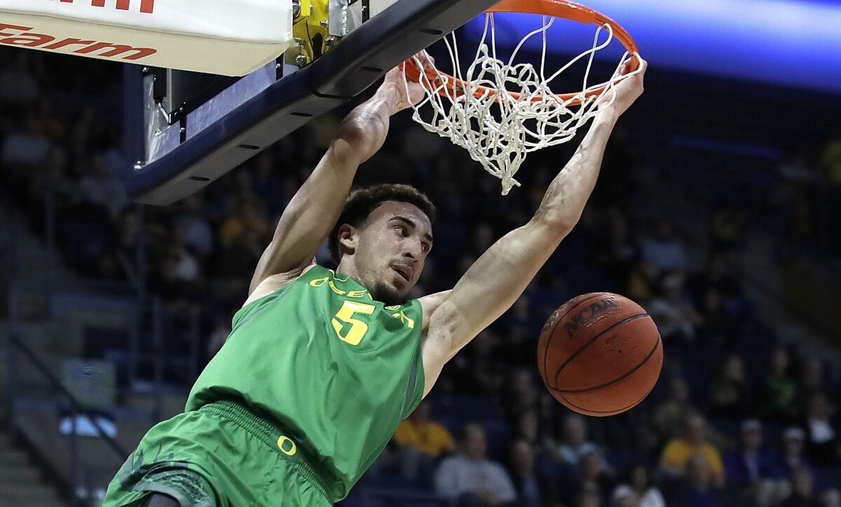 FILE - In this Jan. 30, 2020, file photo, Oregon's Chris Duarte scores against California in the first half of an NCAA college basketball game in Berkeley, Calif. Duarte is The AP Pac-12 player of the year and a member of the All-Pac 12 first team, announced Tuesday, March 9, 2021. (AP Photo/Ben Margot, File)