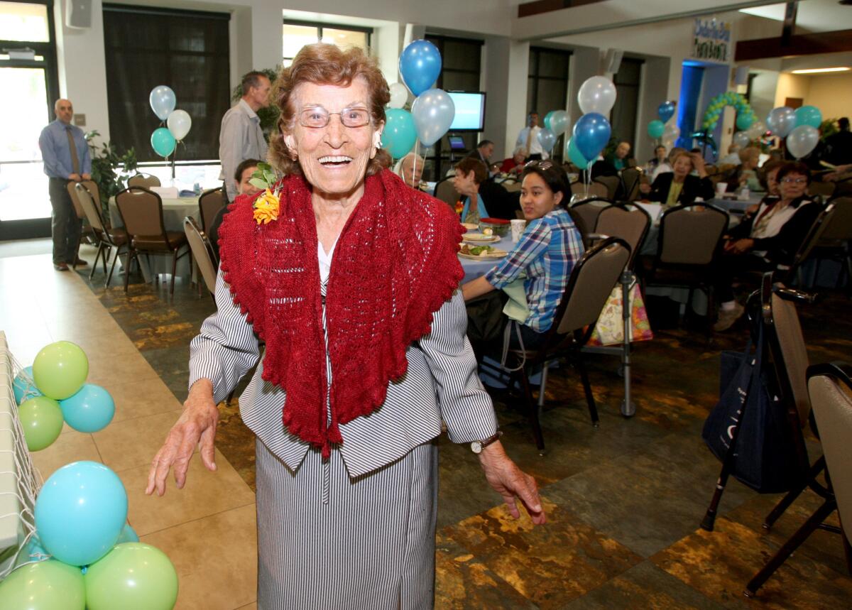 Afifi Masri, 100, shows her big smile during a party for Glendale residents ages 90 and over at the Adult Recreation Center in Glendale on Thursday, May 19, 2016.