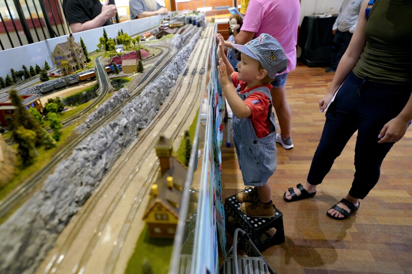 Ezra Fridman, 2 from Mission Valley stood on a step stool to get an up close look at the Thomas the Train exhibit.
