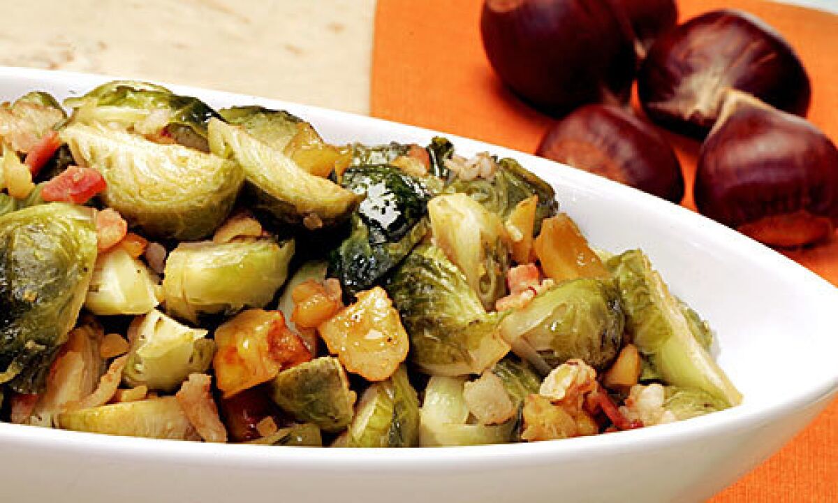 FLAVORFUL SIDE: Brussels sprouts braised with bacon and chestnuts are a robust addition to an autumn meal.