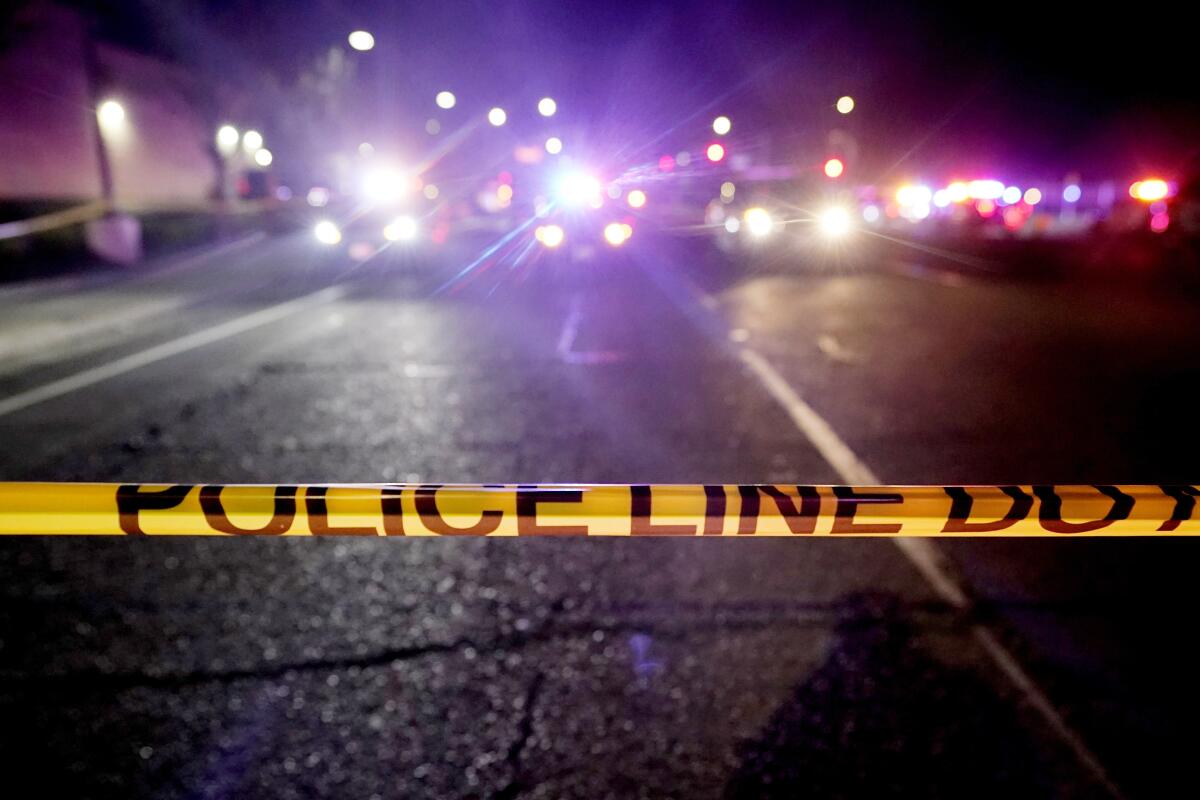 Police tape blocks a road near a crime scene in Sacramento County in 2021.