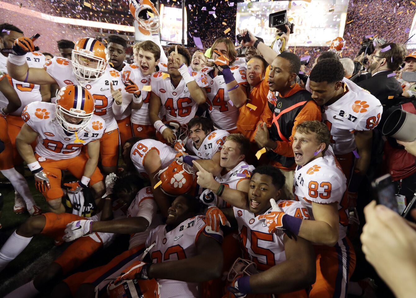 Clemson players celebrate after defeating Alabama, 35-31, in the College Football Playoff national championship game.