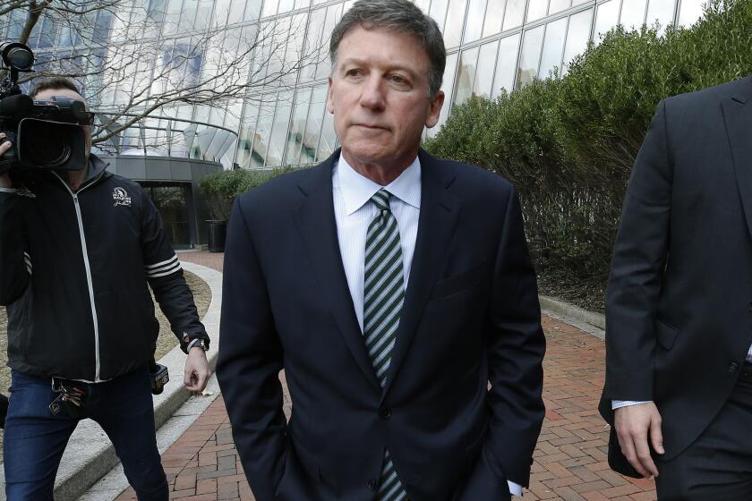FILE - Bruce Isackson departs federal court, April 3, 2019, in Boston after facing charges in a nationwide college admissions bribery scandal. Isackson is scheduled to be sentenced on June 28, 2022. (AP Photos/Michael Dwyer, File)