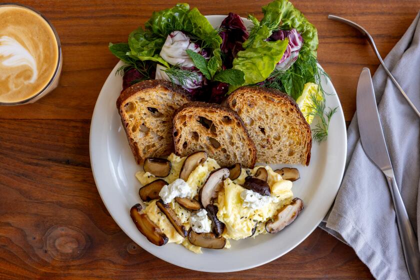 LOS ANGELES, CA - MARCH 14, 2024: A shiitake scramble (eggs crambled with shiitake mushrooms, garlic butter and goat cheese, served with sourdough toast and salad of little gems, raddichio, dill, mint and sherry vinaigrette) from Valerie Confections by Valerie Gordon, a chocolatier, restaurateur, and the owner of the the popular bakery,photographed at the store in Glendale on Thursday, Mar. 14, 2024. Gordon is celebrating the 20th anniversary of her business. (Silvia Razgova / For The Times)