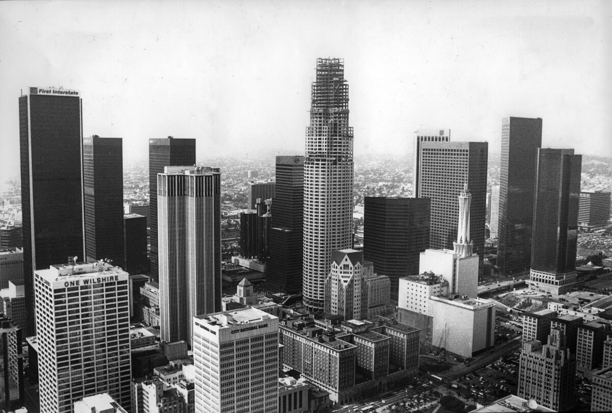 April 14, 1989: The Library Tower, under construction, center, surpasses the First Interstate Building (now the Aon building), left, as the tallest building in downtown Los Angeles.