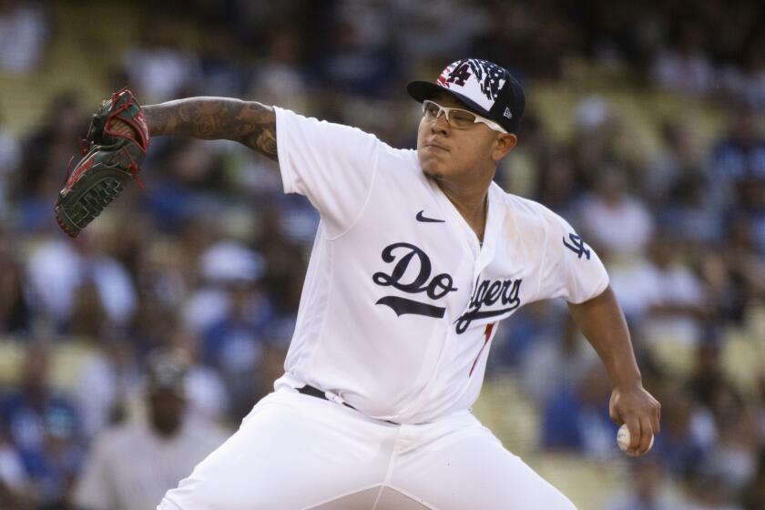 Los Angeles Dodgers starting pitcher Julio Urias throws during the first inning of a baseball game against the Colorado Rockies in Los Angeles, Monday, July 4, 2022. (AP Photo/Kyusung Gong)