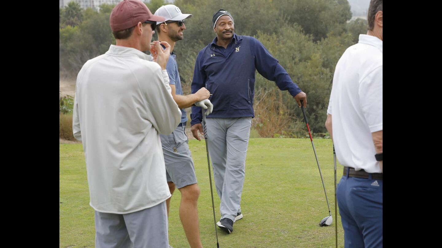Napoleon McCallum who played football for the U.S.Naval Academy and Oakland Raiders, talks will fellow golfers in the Navy-Notre Dame Golf Tournament at the Riverwalk Golf Club in Mission Valley in advance of the football game between the two schools to be held at SDCCU Stadium, Saturday.