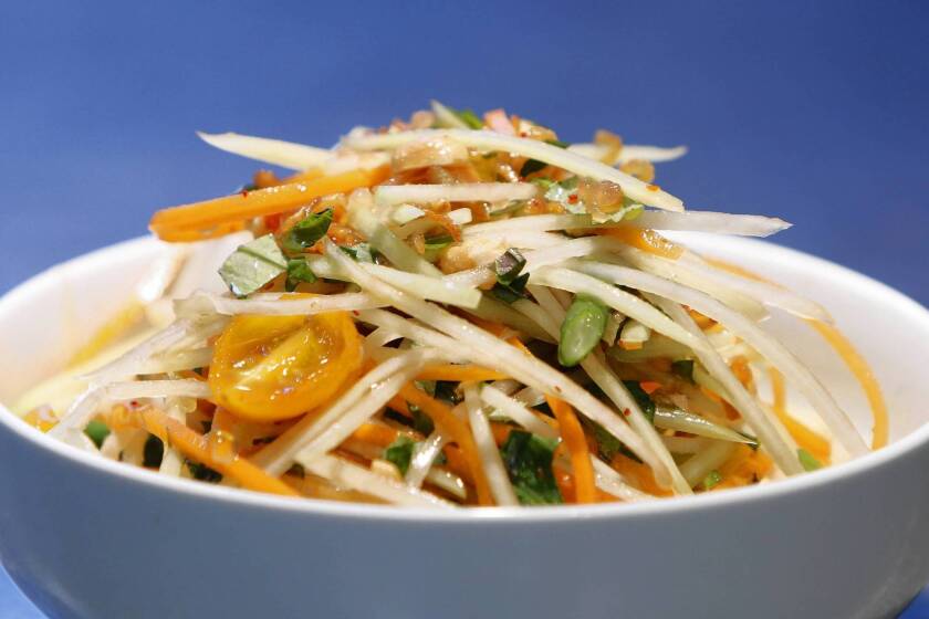 In a green papaya salad, salty fish sauce plays off the flavors of the unripe fruit, tart limes and spicy chiles.