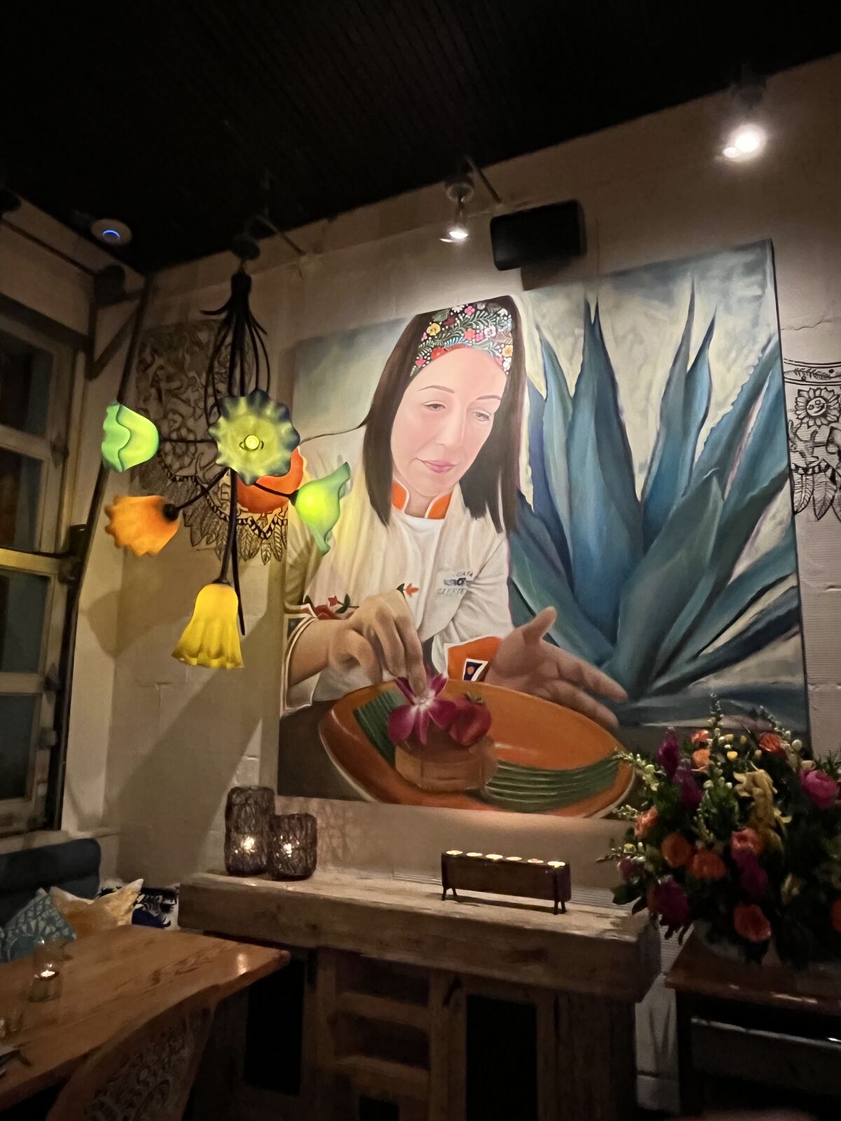 A mural on the wall inside Casa Gabriela in La Mesa depicts its founding executive chef, Gaby Lopez.