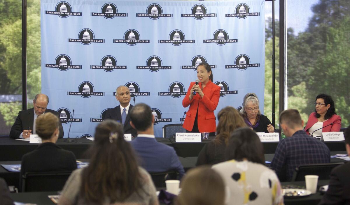 Democratic candidates for lieutenant governor, Eleni Kounalakis, standing, and Jeffrey Bleich, far left, are former Obama officials.