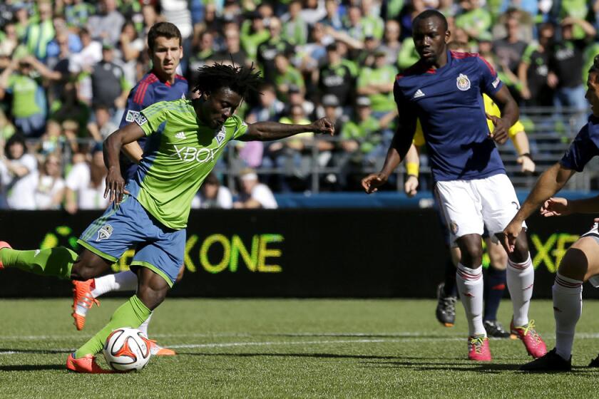 Sounders forward Obafemi Martins prepares to launch a shot that would find the net against Chivas USA in the second half Saturday afternoon in Seattle.