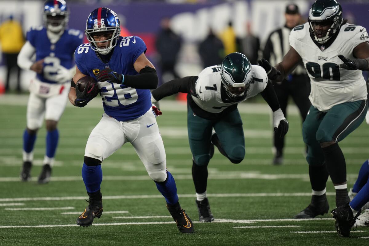 New York Giants running back Saquon Barkley (26) carries the ball against the Philadelphia Eagles.