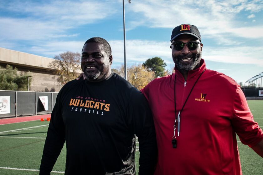 L.A. Wildcats defensive coordinator Pepper Johnson and General Manager Winston Moss