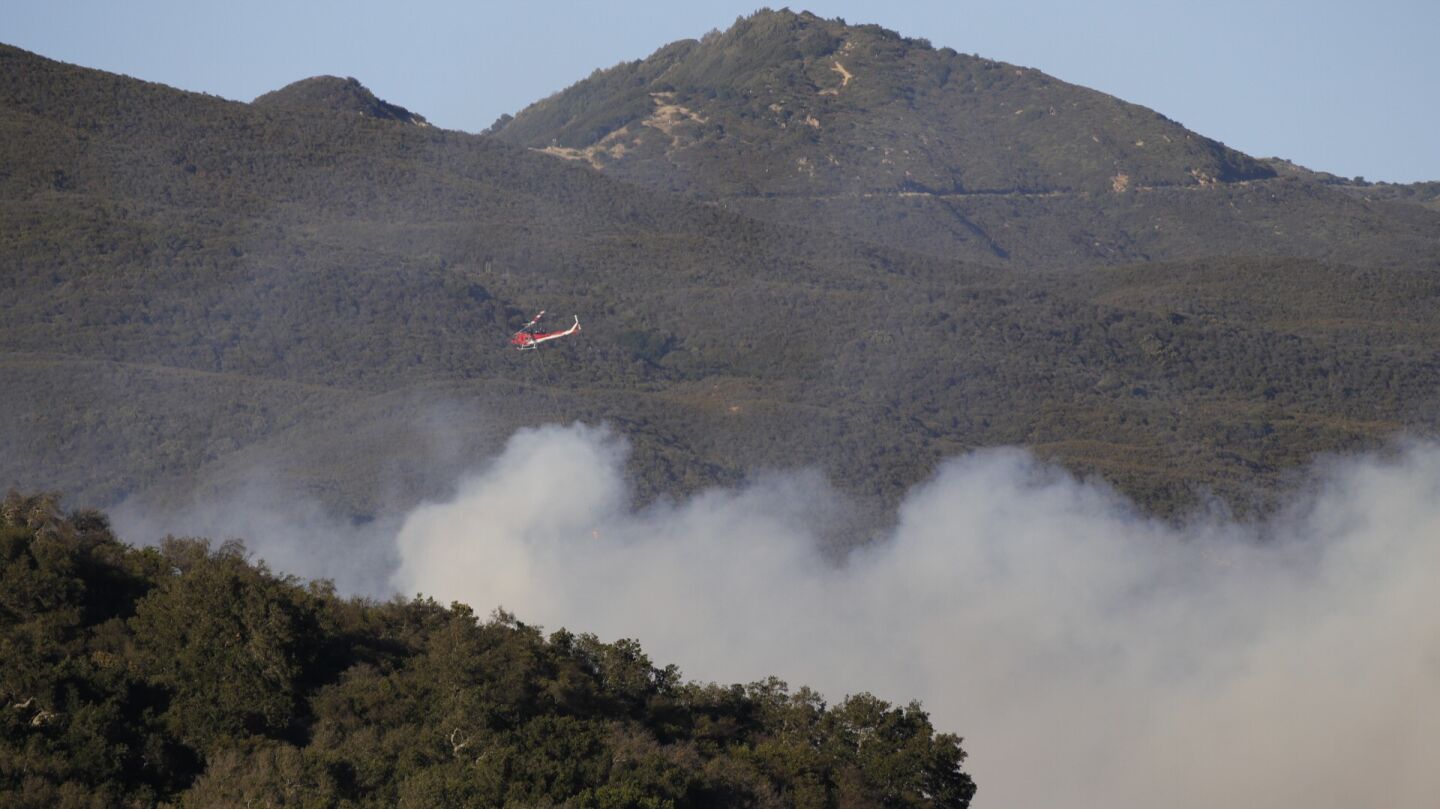 Water-dropping helicopters try to get the upper hand on a brush fire in the Santa Ynez mountains. The fire broke out Wednesday afternoon near the Ronald Reagan Ranch above the El Capitan Ranch area west of Goleta.