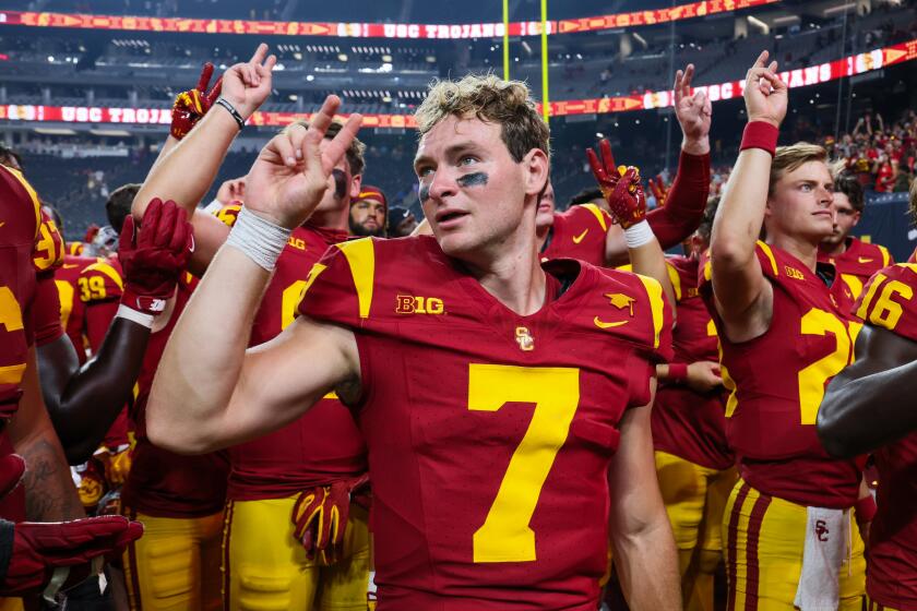  USC quarterback Miller Moss celebrates with teammates after beating LSU in Las Vegas