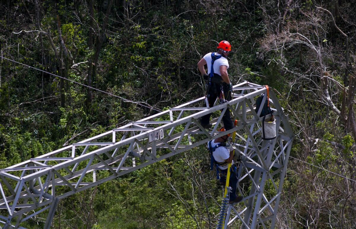 Workers restore power lines