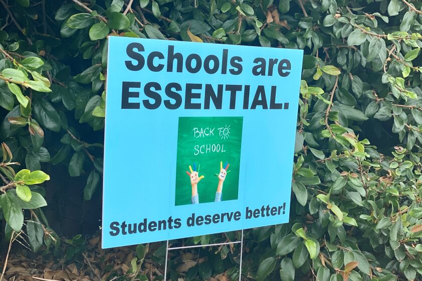 This is one of several signs seen posted Aug. 24 on the perimeter of La Jolla High School.