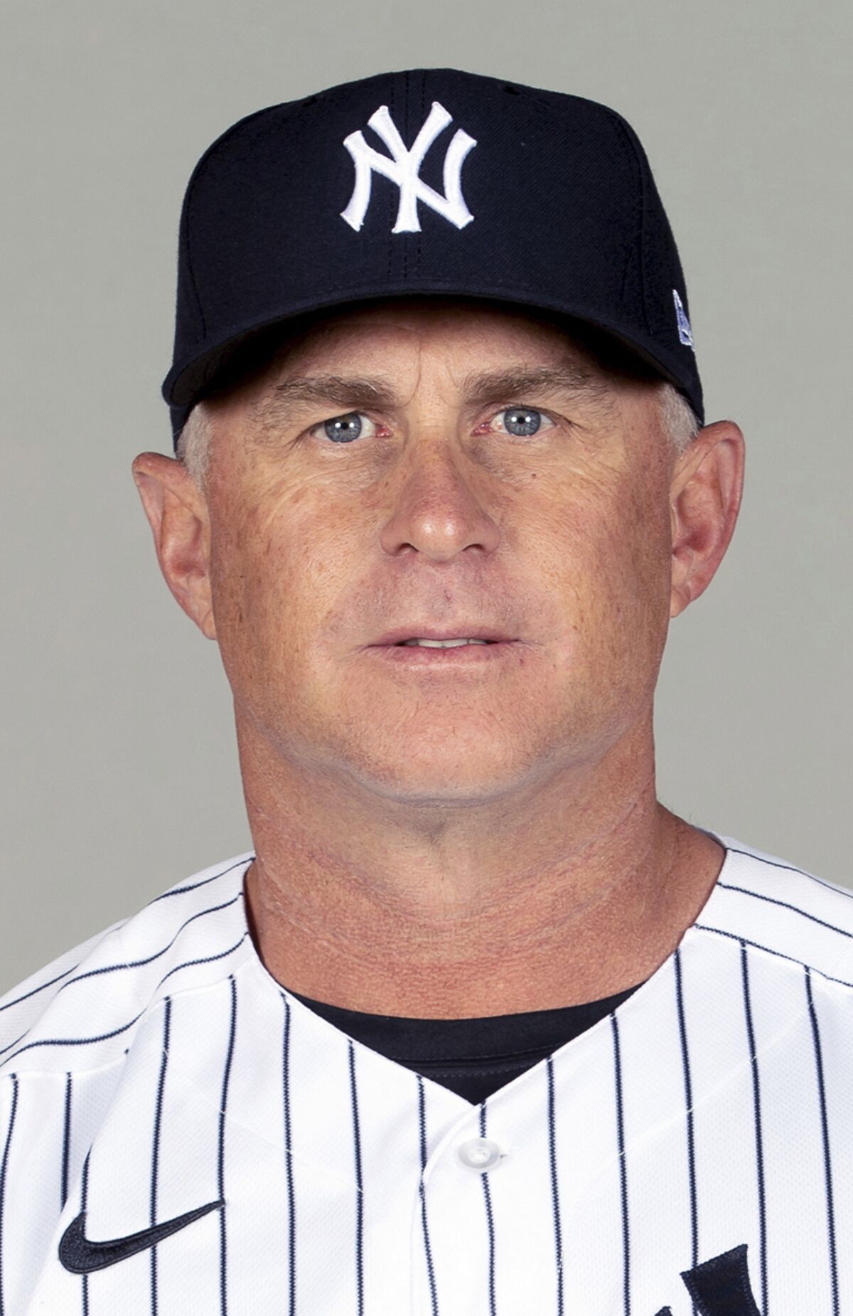 This is a 2021 photo of Phil Nevin of the New York Yankees baseball team. The Yankees announced Tuesday, May 11, 2021, that third base coach Phil Nevin, who is fully vaccinated, has tested positive for the coronavirus. Nevin is currently under quarantine protocol in Tampa. Under Major League Baseball’s guidance and advice, and with its assistance, additional testing and contact tracing are ongoing. (Mike Carlson/MLB Photos via AP, File)