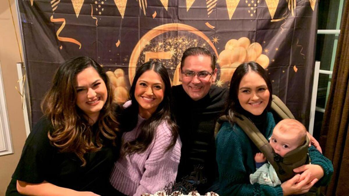 Luis Tovar is surrounded by his three daughters, Genevieve Raygoza, Thalia Tovar and Vania Tovar.  