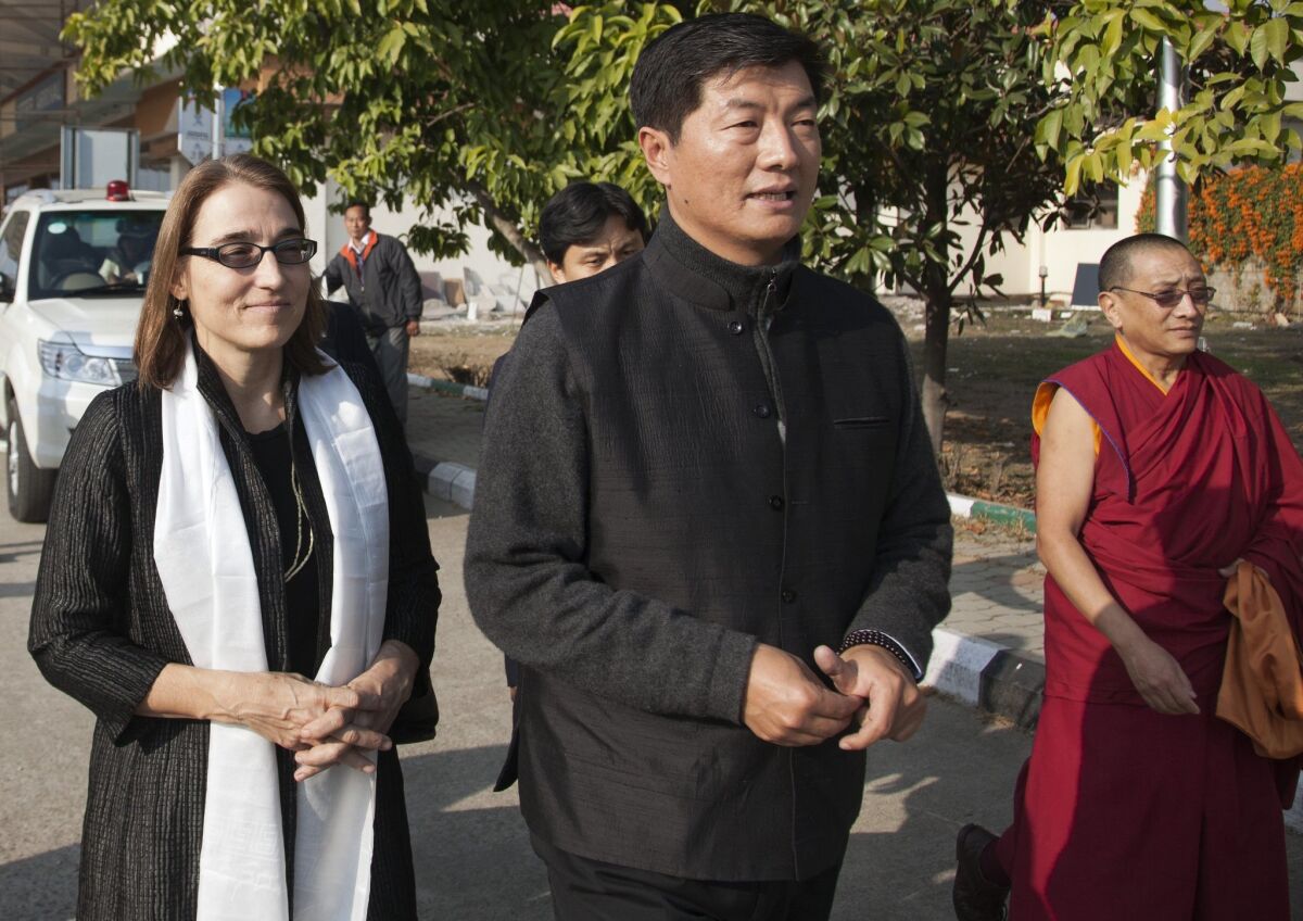 Lobsang Sangay, prime minister of Tibet's government in exile, walks with Sarah Sewall, U.S. undersecretary of State for civilian security, democracy and human rights, during a meeting in Dharmsala, India, on Jan. 15.