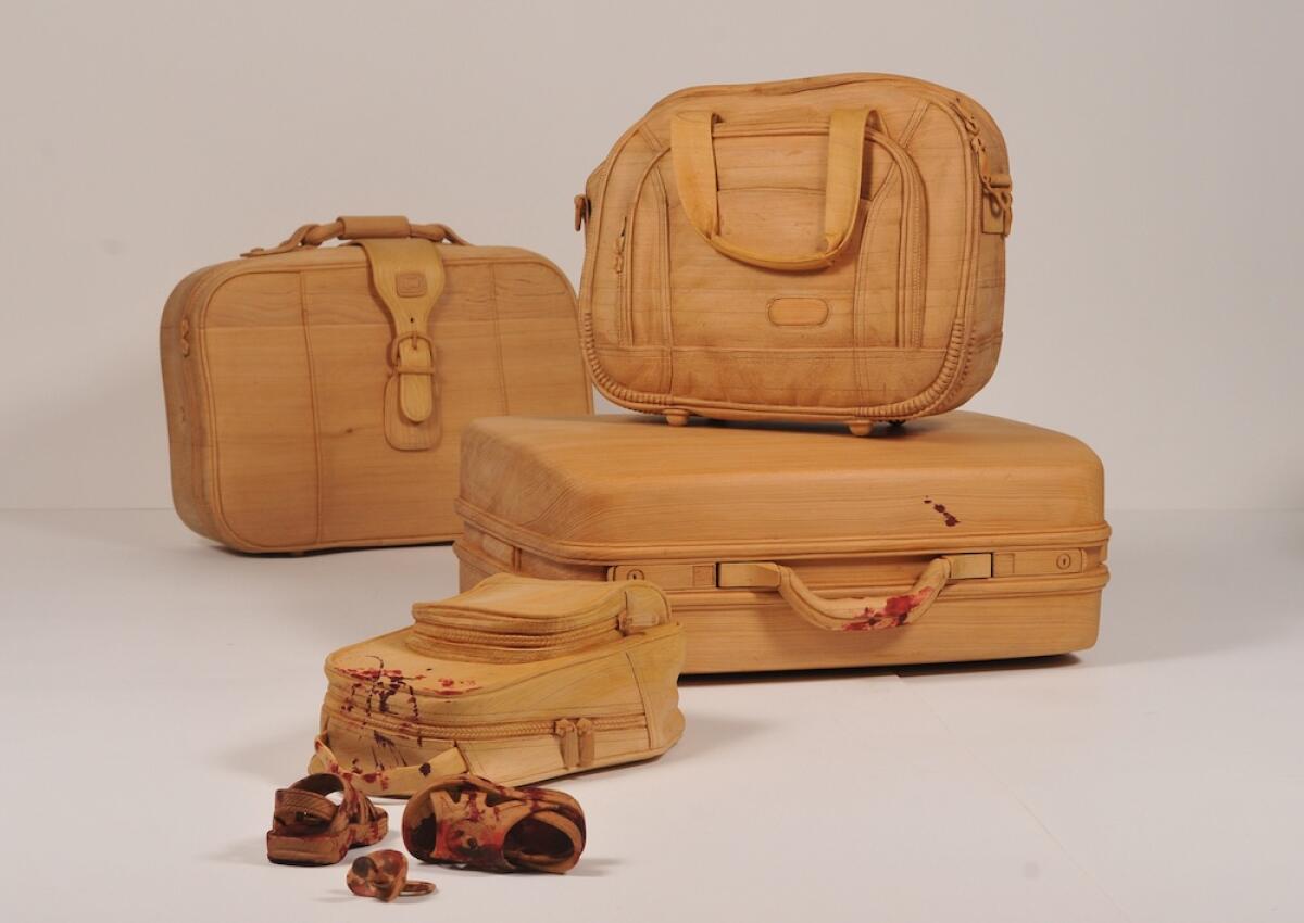 Humaira Abid's installation "Searching for Home," 2016–17, is made of carved pine and red wood stain.
