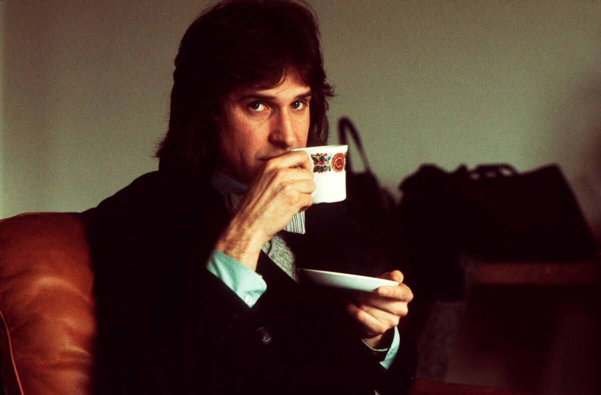 A man sipping tea