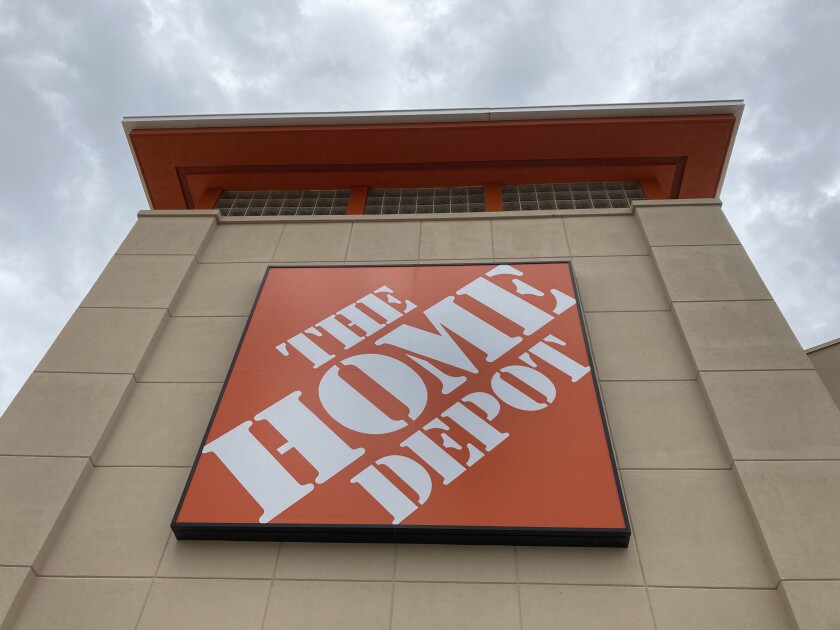 FILE - A Home Depot logo sign hands on its facade, Friday, May 14, 2021, in North Miami, Fla. he Home Depot on Thursday, Jan. 27, 2022, named a veteran executive as its new CEO. Edward “Ted” Decker, who has served as Home Depot’s chief operating officer since October 2020, will become president and CEO on March 1. (AP Photo/Wilfredo Lee, File)