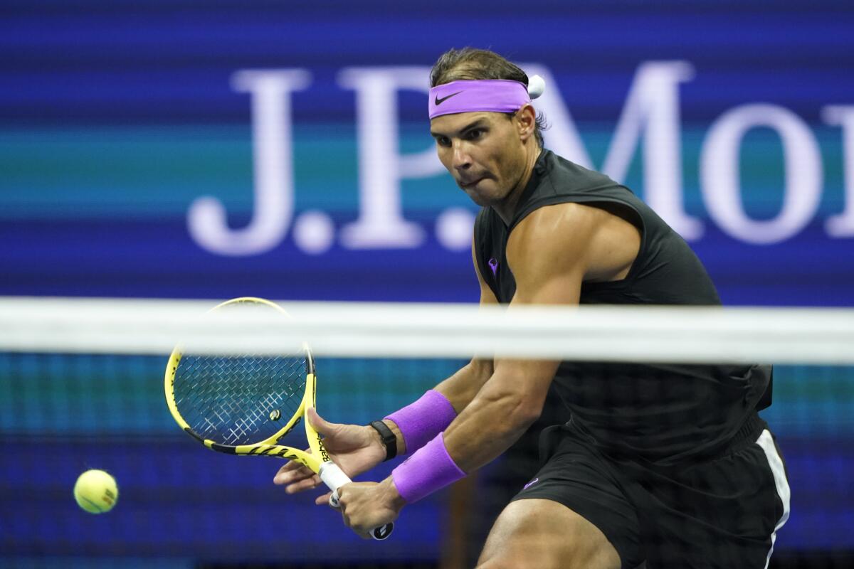 Rafael Nadal prepares to volley a shot against Matteo Berrettini during a men's singles semifinals at the U.S. Open on Friday.