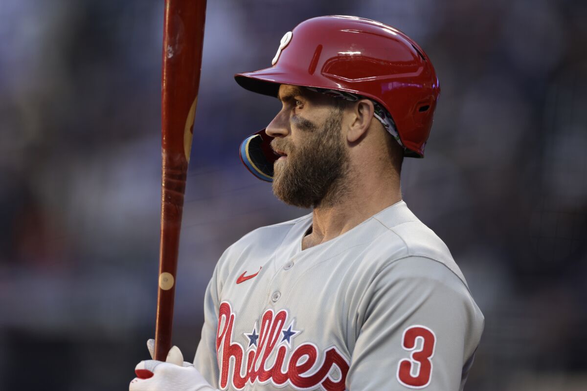 Philadelphia Phillies' Bryce Harper stands in the on-deck circle during the first inning of the team's baseball game against the New York Mets on Friday, April 29, 2022, in New York. (AP Photo/Adam Hunger)