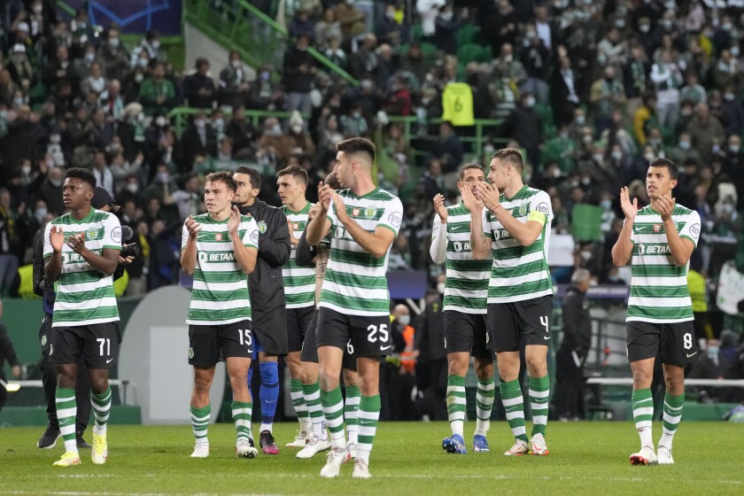 Sporting CP players react following their Champions League Group C soccer match against Borussia Dortmund at the Alvalade stadium in Lisbon, Portugal, Wednesday, Nov. 24, 2021. (AP Photo/Armando Franca)