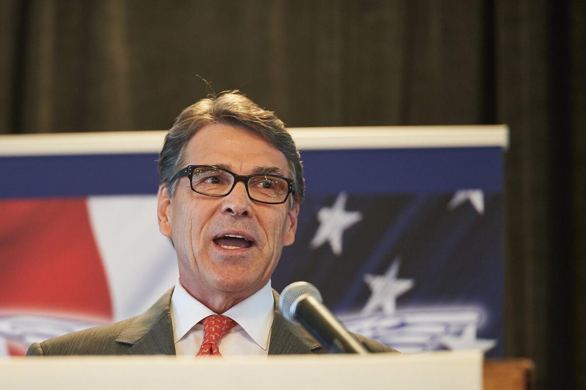 Former Texas Gov. Rick Perry tells a crowd in St. Louis that he is suspending his run for the White House.